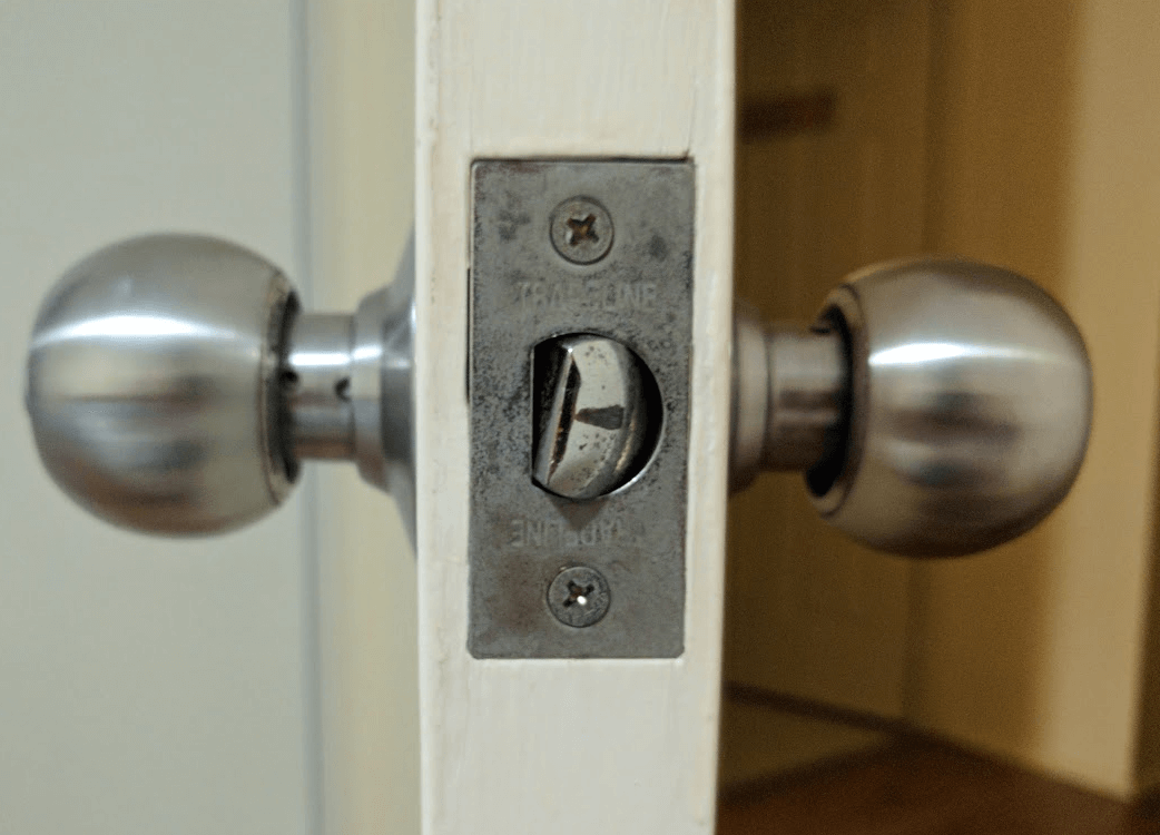 https://diy.stackexchange.com/questions/105969/how-to-stop-door-knob-latch-from-twisting-and-sticking-on-strike-plate